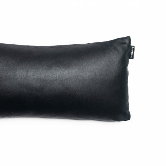 autonomy leather travel pillow pictured on a white background